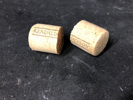 Take your standard wine cork and cut it in half with a sharp razor knife. This will let you easily make plugs for both sides from a single cork. Of course, if you want to have different corks on each side, you can do that. It doesn't really matter.