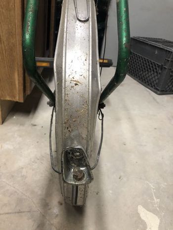 The rear fender had a hard life but I think it can be straightened out and useful again. The rear light, however, appears to be a goner. I need to decide if I'm keeping the wiring.