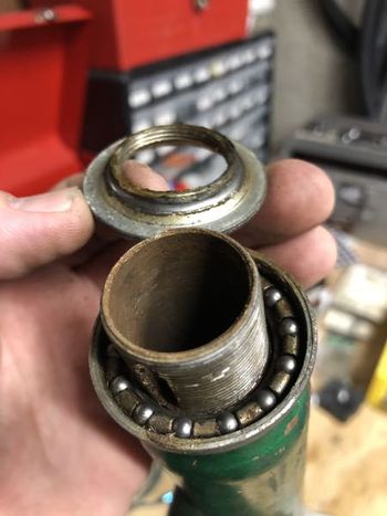 The headset had no discernible grease, and didn't appear to have had any grease in a long, long time. That probably explains why it made graunchy, gravelly sounds. The whole headset will have to be replaced.