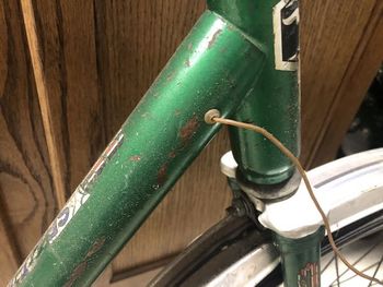 Originally it was wired through the frame to run front and rear lights. The generator and front light are long gone, and I'm not sure how the wiring worked given that the frame separates.