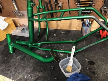 With the decals removed, plus a lot of scrubbing and the initial sanding done, I brushed the entire frame with phosphoric-acid-based rust converter.