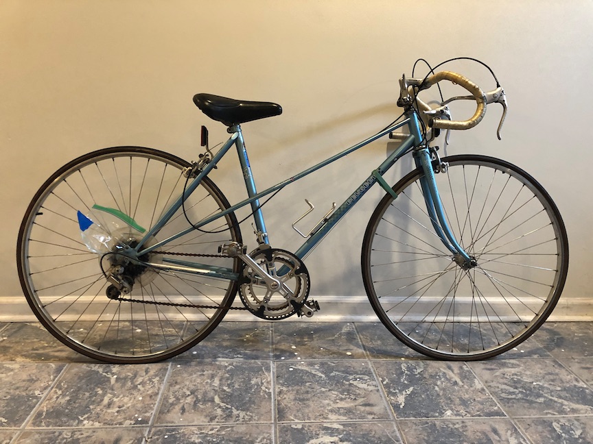 The Peugeot, as found on the local marketplace site., immediately after transport to my basement. The blue tape and plastic bag on the rear wheel is holding parts of the rear derailleur.