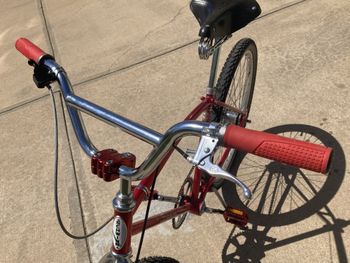 Modern klunker-style bars and a pretty good reproduction of an 80s BMX stem.