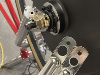 I also had to drill out the mounting holes for the Wald rack a lot to fit the oversize axle. Here you can see one size enlarged and the other still in the original size.