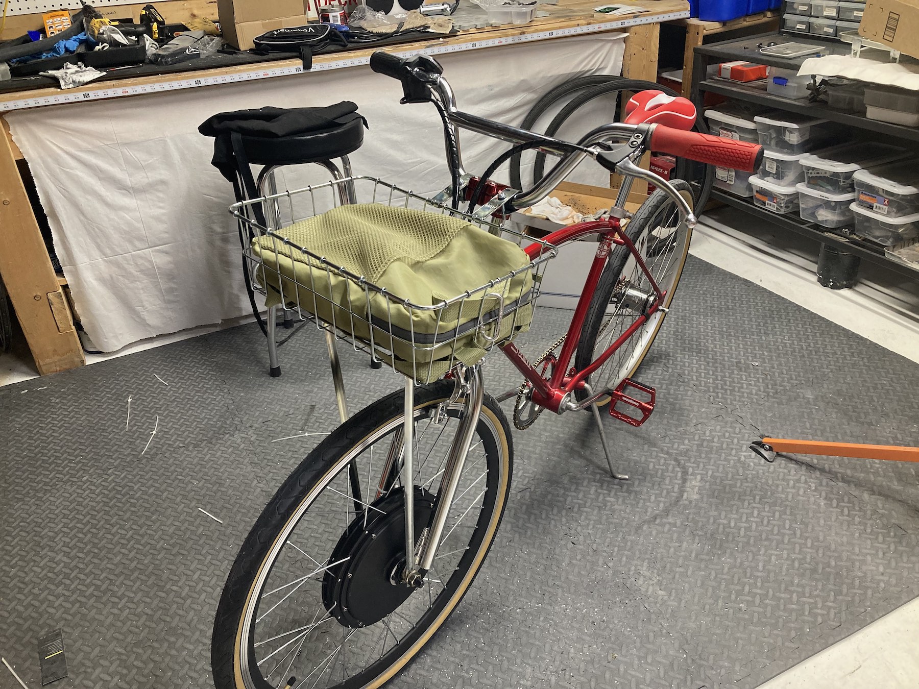 I had a cheap IKEA backpack that coincidentally fit the Wald basket perfectly and hid all the electric parts. You can also see the brake levers have changed. That's because the e-bike kit cuts power when you use the brakes, so you have to use their levers.