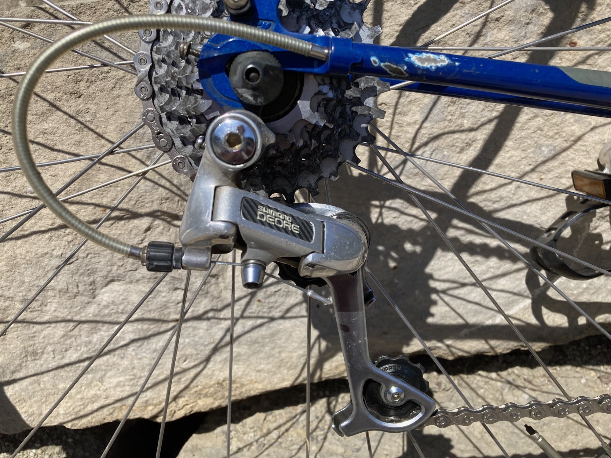 These scuffs by the rear derailleur were about the only blemishes in the paint, and I came to see them more as beauty marks, so I didn't attempt to touch them up and instead just put some clear-coat over them to keep the rust at bay. Also, the early Deore derailleurs Trek used are incredibly capable, even today, for anything up to 10 speed and 36 teeth. Amazing, given how old they are.