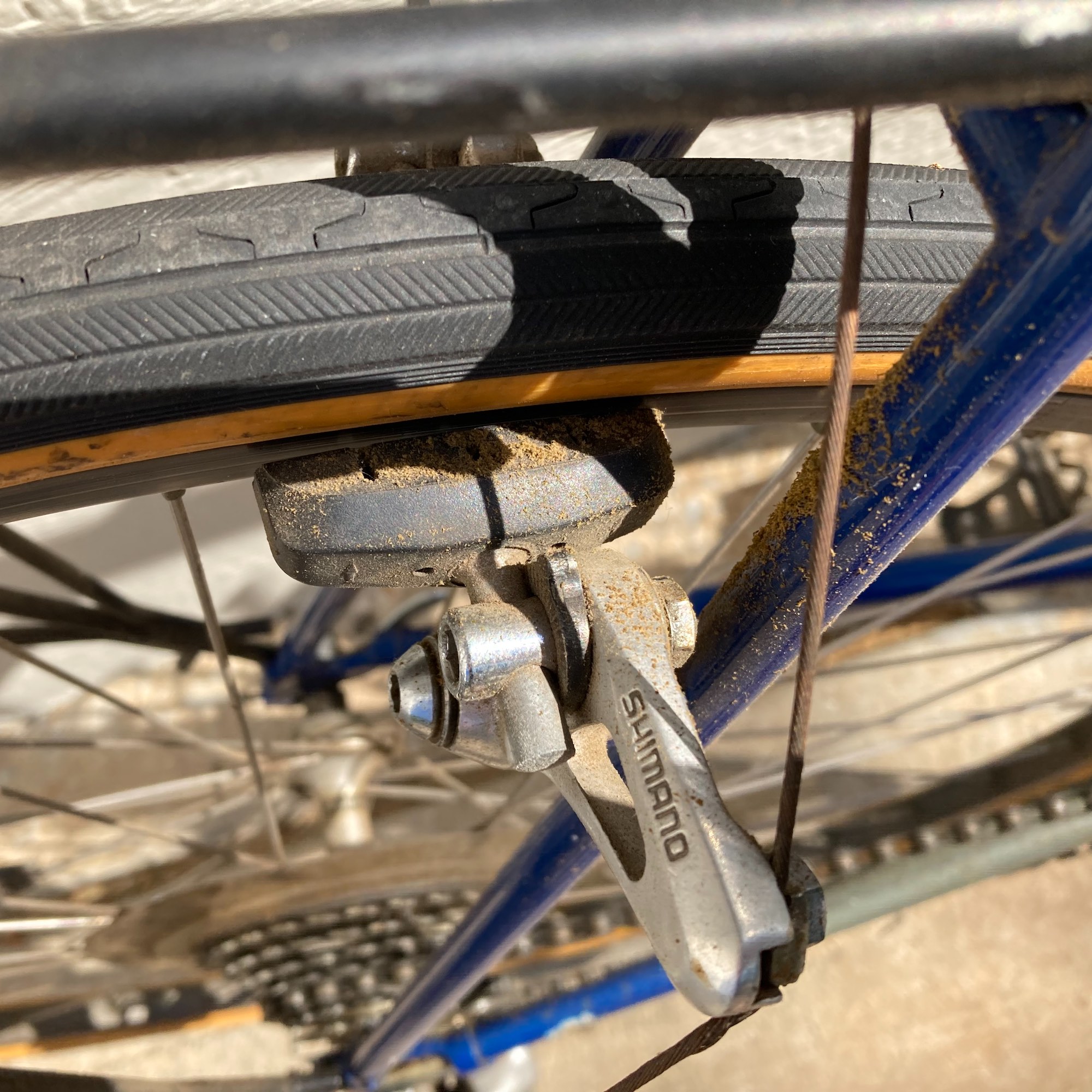 A closer look shows how it really was. The brakes were destroying the gumwall tires, everything was dirty and crusty, and all the cables were rusty.