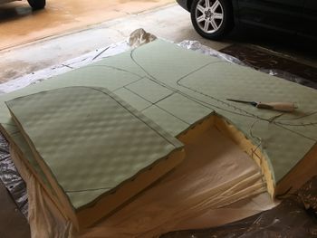Before I tossed the old cushions I had the good sense to make patterns from them on heavy brown paper. Those were really handy later, when I needed to cut new cushions. The new cushions were cut from a 5-inch memory foam mattress from Amazon, and the houselhold electric carving knife, which is a pretty good solution for cutting foam.
