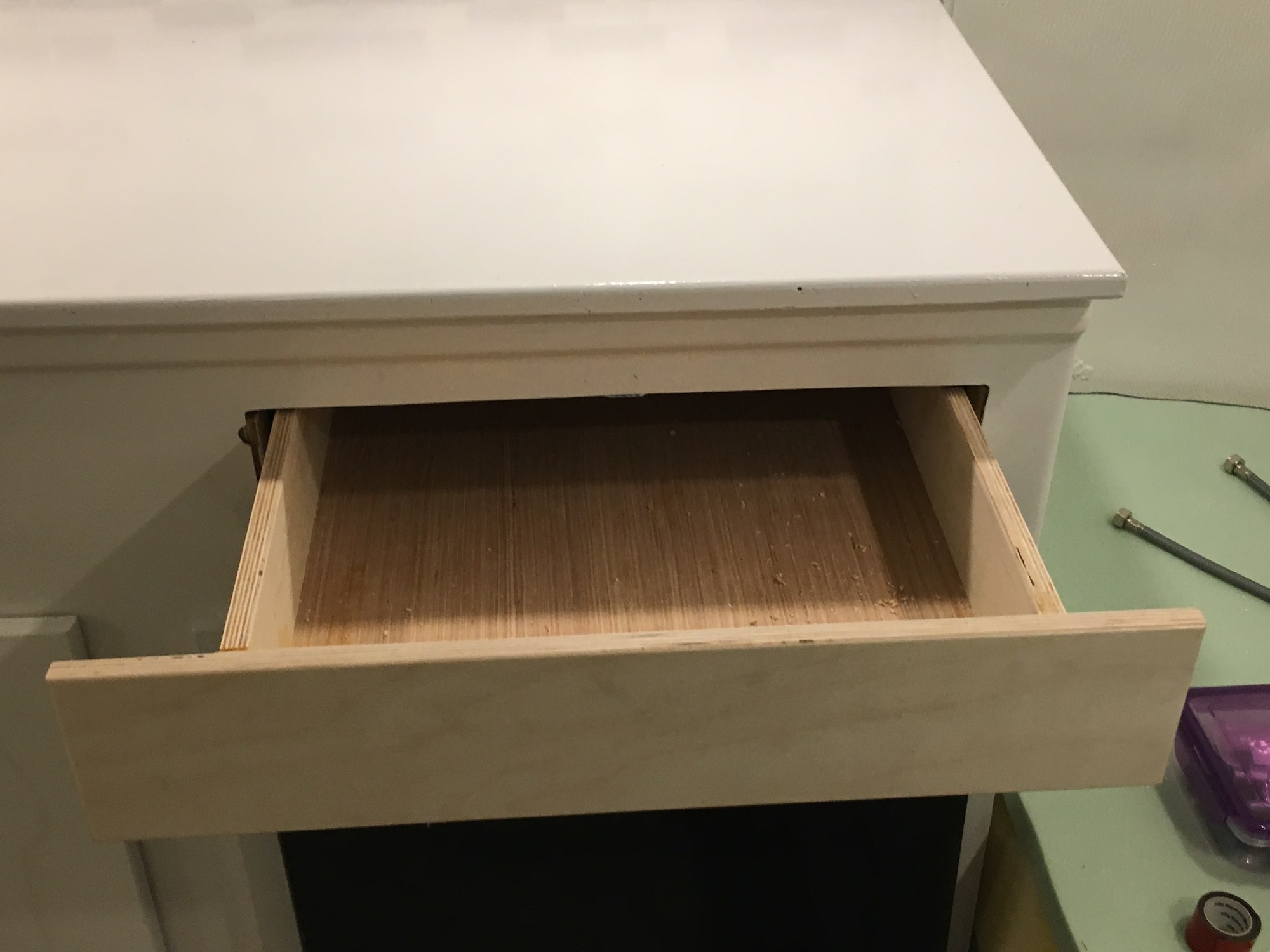 I was really proud of this drawer I built from scratch, including all the mounting points. The original drawer slid out from the bottom of the stove, and both it and the stove were unsalvageable. So I had to get creative.