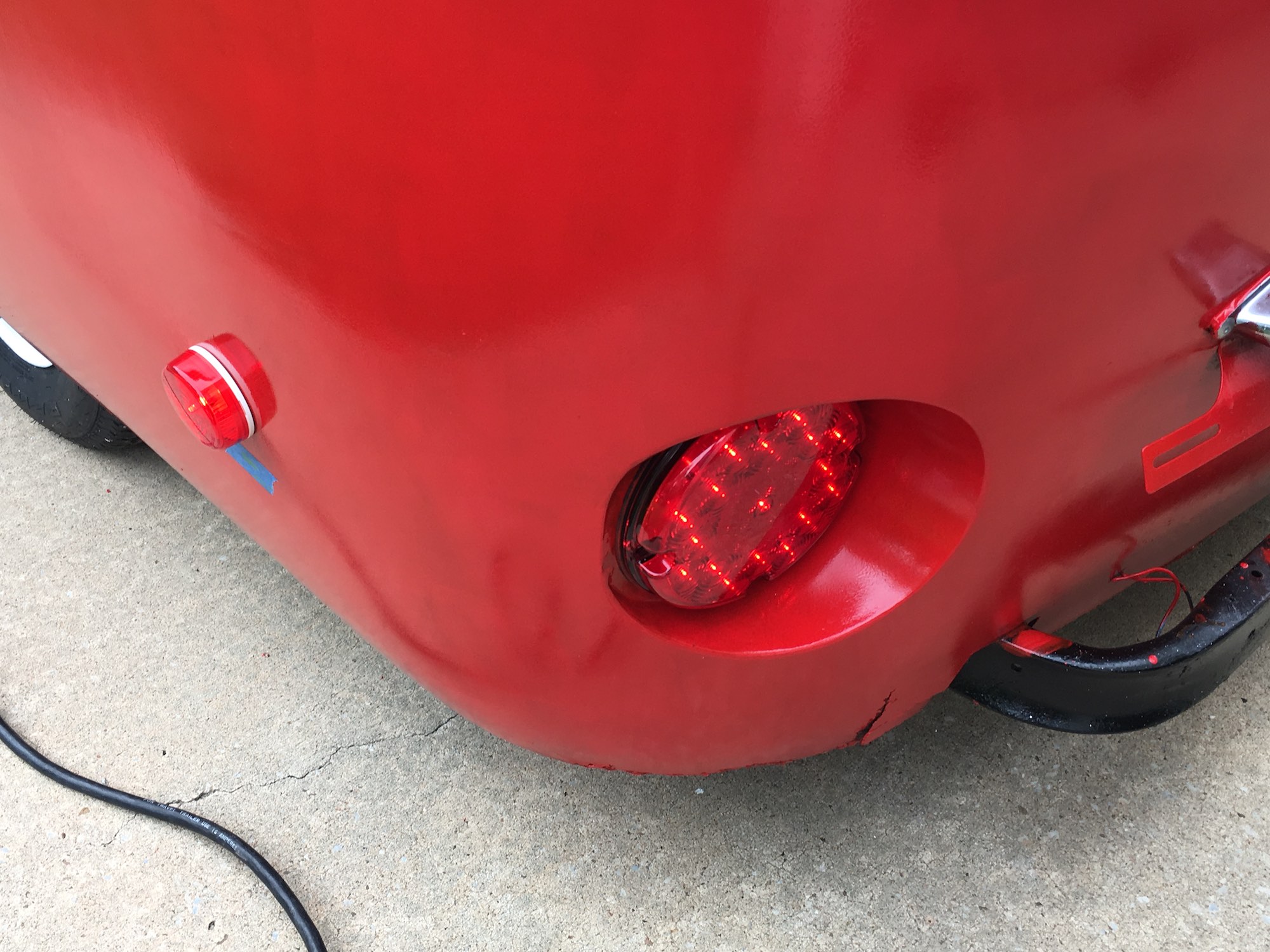 All the exterior lights were upgraded to modern LED versions. Yes, that's another tiny bit of fiberglass damage by the bumper. It's 50 years old, it's picked up some scrapes.