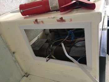Trimmed and caulked. You can see the red fiberglass putty filling some more holes too.